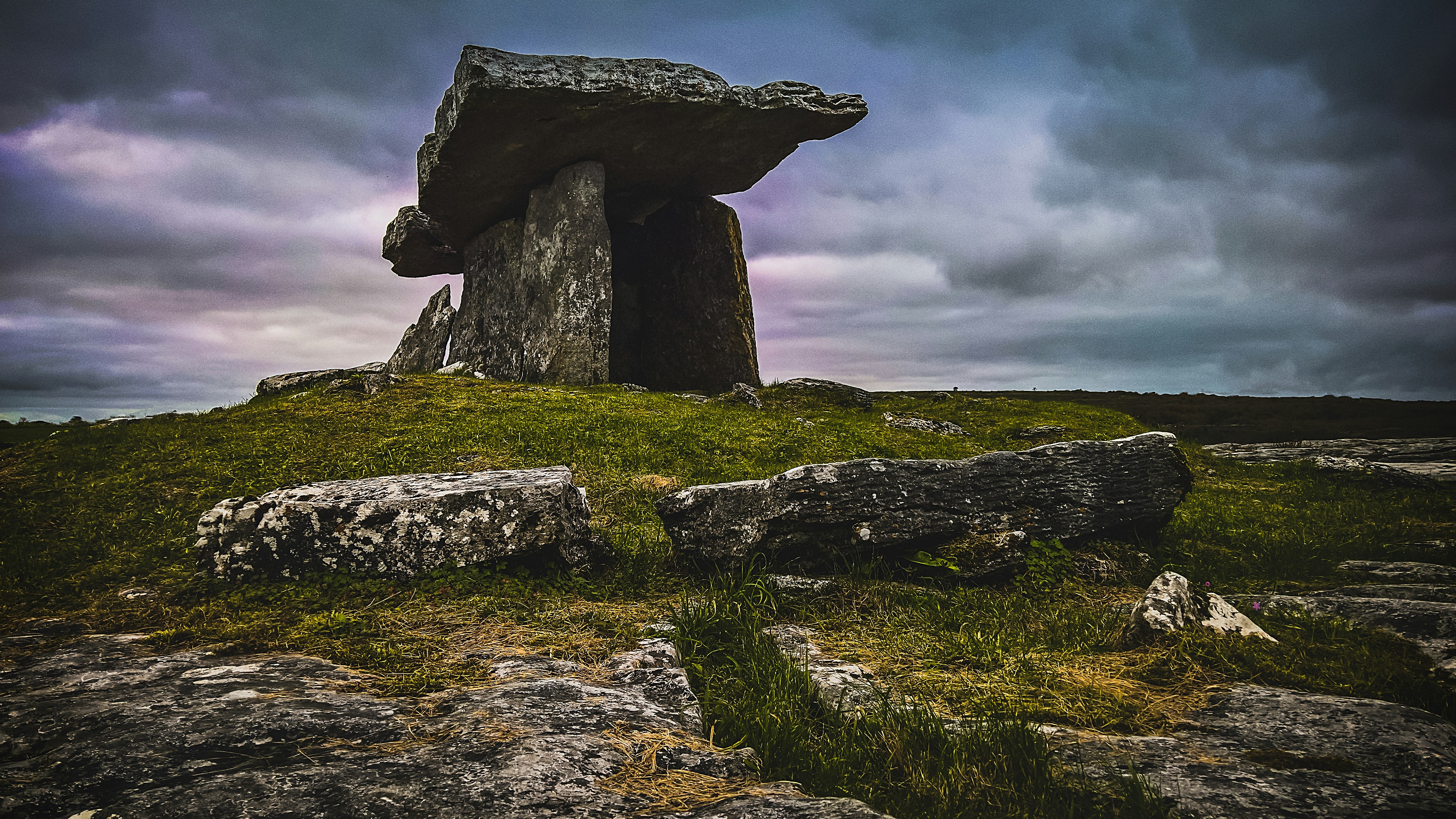 stone structure in green field